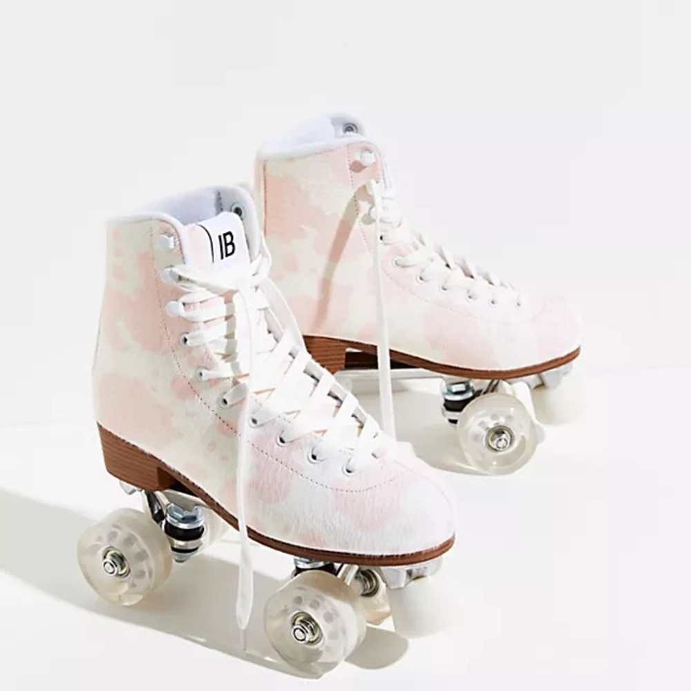 INTENTIONALLY BLANK Pink and White Roller Skates